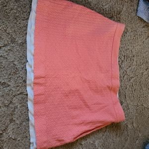 Pink skirt with white trim underneath